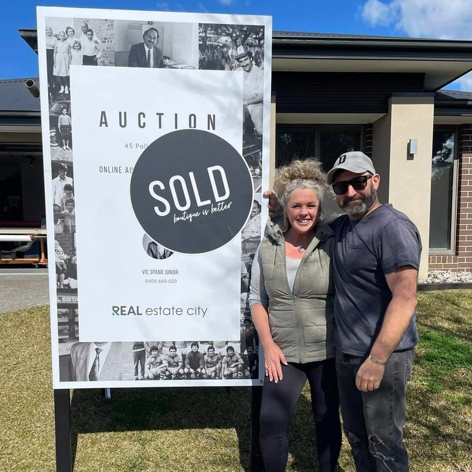 Couple-Near-Their-Sold-Property